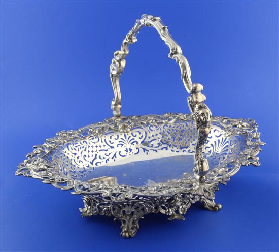 A good Victorian pierced silver oval cake basket by The Barnards, 52.5 oz.